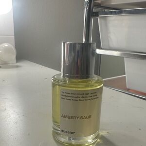 Dossier Ambery Sage Face Oil with Silver Cap and Yellow Tint